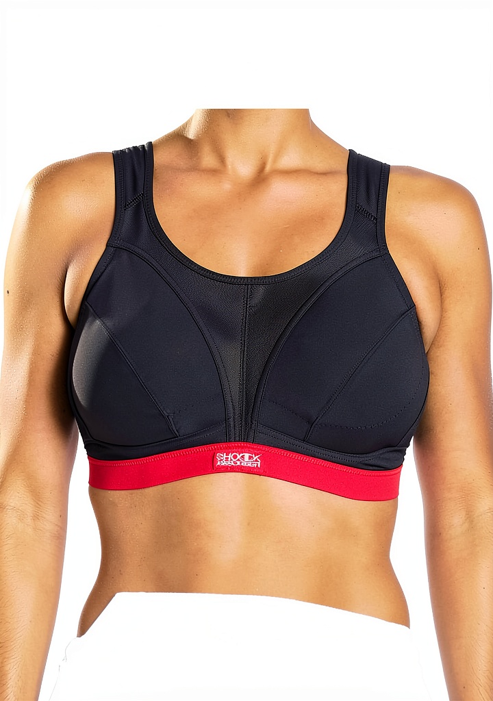 Femme portant le soutien-gorge sportif Shock Absorber lors d'une séance de fitness en salle